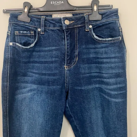 Free People high waisted dark wash straight leg jeans frayed / distressed bottom