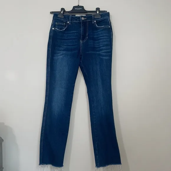 Free People high waisted dark wash straight leg jeans frayed / distressed bottom