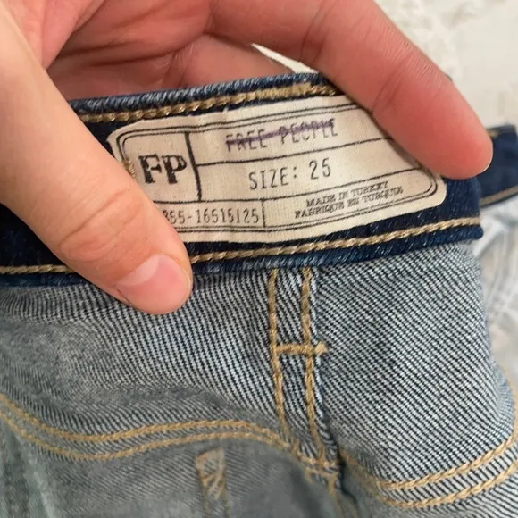 Free People high waisted dark wash straight leg jeans frayed / distressed bottom
