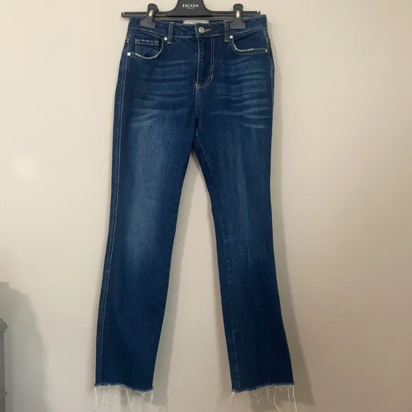 Free People high waisted dark wash straight leg jeans frayed / distressed bottom