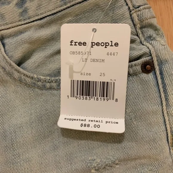 Free people light distressed denim shorts