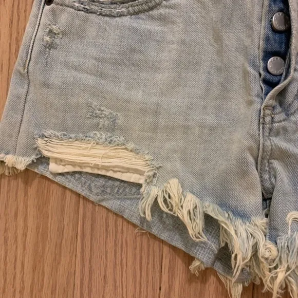 Free people light distressed denim shorts